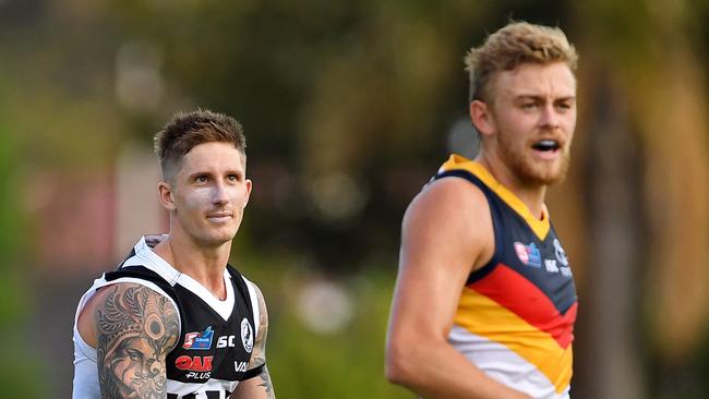 Power vice-captain Hamish Hartlett and Crows AFL regular Hugh Greenwood line up on each other earlier this season. Picture: Tom Huntley