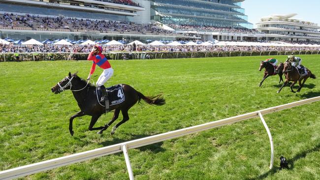 James McDonald celebrates as Verry Elleegant charges away with the Melbourne Cup. Picture: Racing Photos via Getty Images