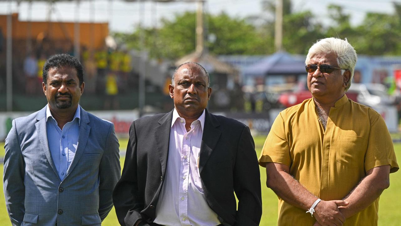 Sri Lanka's cricket legends Muttiah Muralitharan (L), Aravinda de Silva (C) and Arjuna Ranatunga pose for pictures during the first day play of the first cricket Test match between Sri Lanka and Australia at the Galle International Cricket Stadium in Galle on June 29, 2022. (Photo by ISHARA S. KODIKARA / AFP)