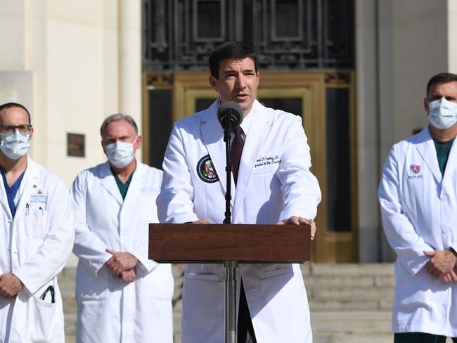 White House physician Sean Conley, centre, answers questions surrounded by other doctors, during an update on the condition of US President Donald Trum. Picture: AFP