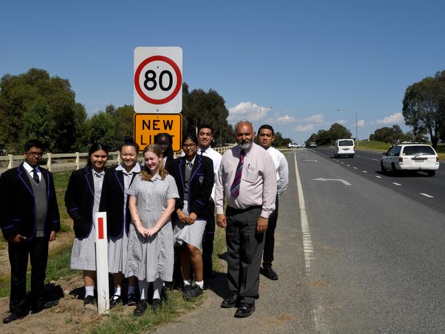 Principal of Lighthouse Christian College Cranbourne Jacob Mathews and students outside the school after a new speed limit was set. Picture: Penny Stephens