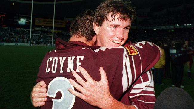 Ben Ikin embraces Maroons teammate Mark Coyne as Queensland celebrate their Game One win against NSW in 1995.