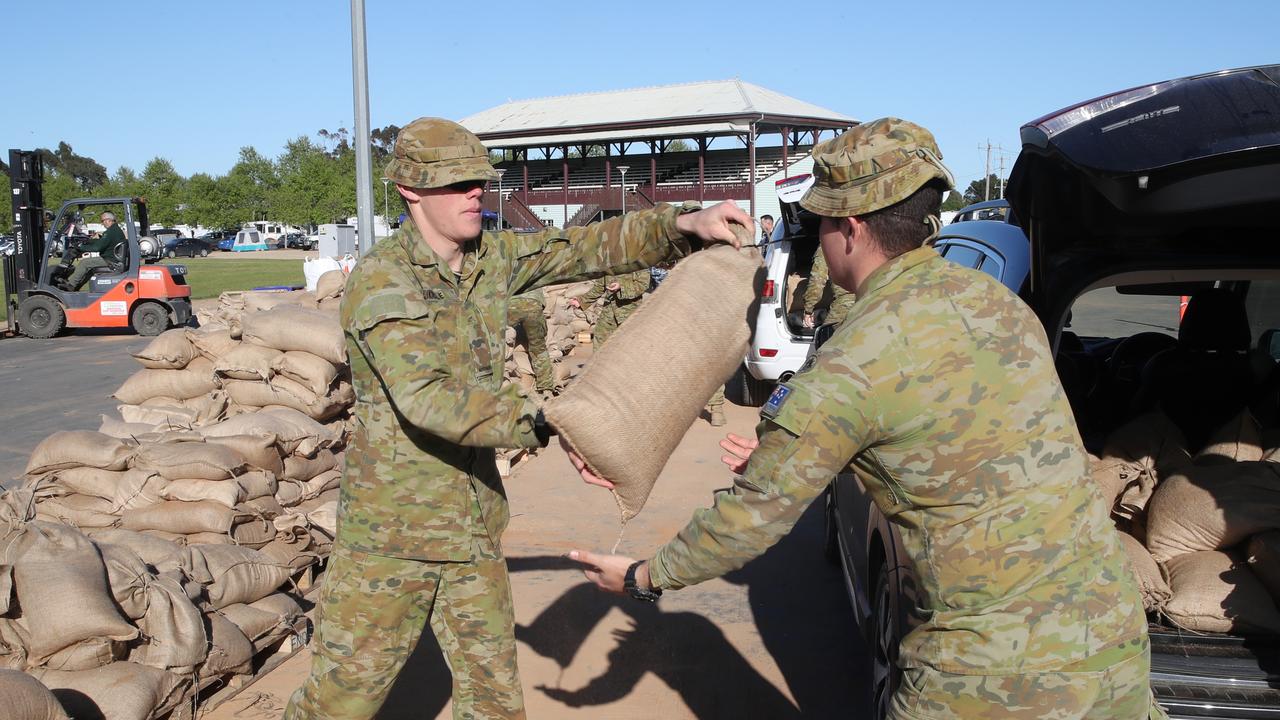 The race is on to fill sandbags at the Showgrounds as Shepparton continues to battle flood waters. Picture: David Crosling