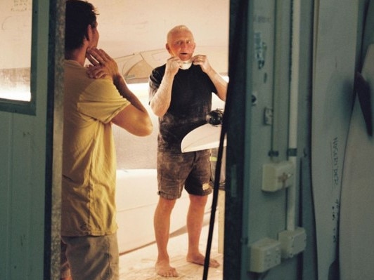 Australian surfing pioneer Bob McTavish, 80, (right) still works at his family's surfboard factory at Byron Bay. Picture: McTavish Surfboards