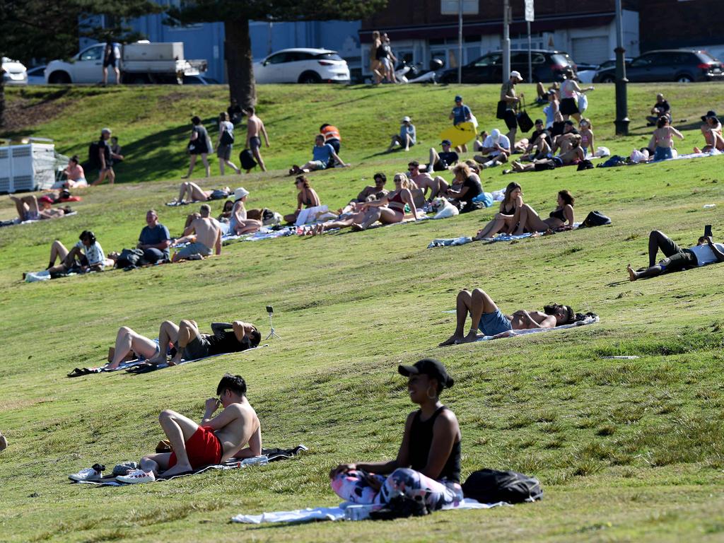 People spaced out along the grass to enjoy the warm weather. Picture: NCA NewsWire/Bianca De Marchi