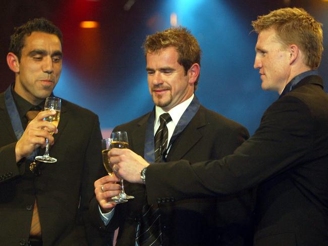 SEPTEMBER 22, 2003 : L-R AFL footballers Adam Goodes, Mark Ricciuto & Nathan at Melbourne's Crown Casino 22/09/03 celebrating historic Brownlow medal three-way tie. Pic Michael Dodge.Australian Rules