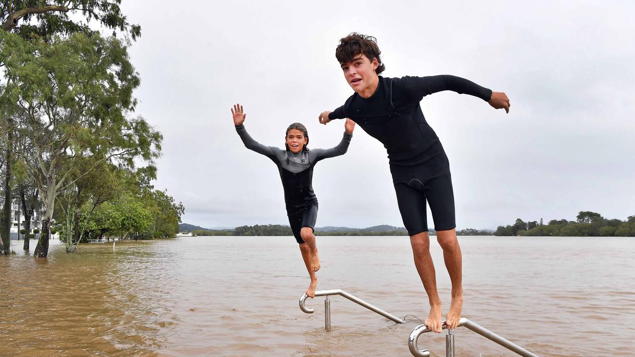 Bradman Ave remains closed as residents prepare for more rain and heavy flooding to hit the Sunshine Coast. Making the most of it are Blake and Jack Emerson-Currell. Picture: Patrick Woods.