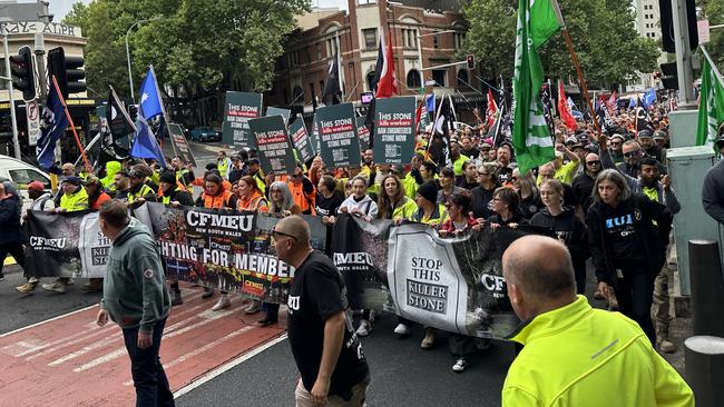 CFMEU workers march in Sydney on October 26, 2023, demanding a ban on engineered stone products. The march comes one day before health ministers meet to consider a ban on the common household products, which has been shown to pose health risks to stone masons. Picture: Supplied