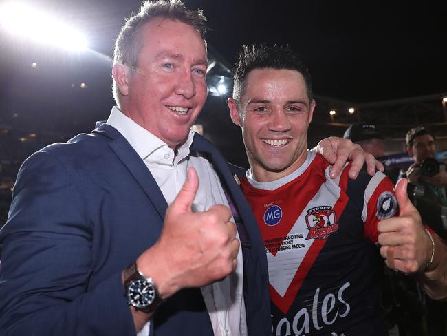 Cooper Cronk and Trent Robinson celebrate victory at full time after the 2019 NRL Grand Final between the Sydney Roosters and Canberra Raiders at ANZ Stadium, Sydney. Picture: Brett Costello