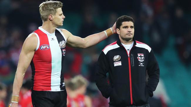 Nick Riewoldt with the injured Leigh Montagna. Picture. Phil Hillyard