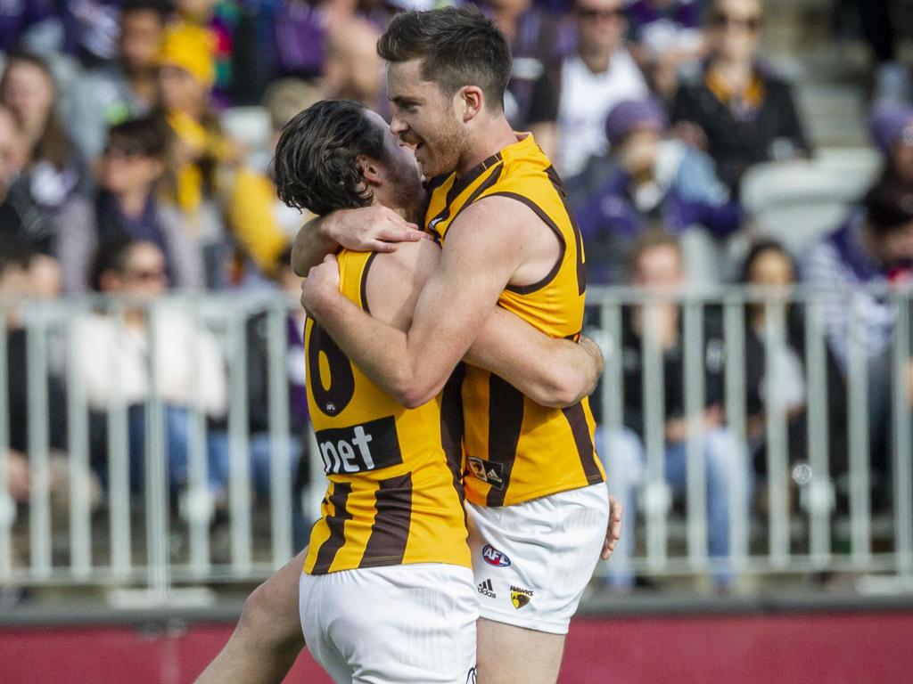 Hawthorn celebrate a goal during the Round 19 AFL match between the Fremantle Dockers and the Hawthorn Hawks at Optus Stadium in Perth, Sunday, July 29, 2018. (AAP Image/Tony McDonough) NO ARCHIVING, EDITORIAL USE ONLY