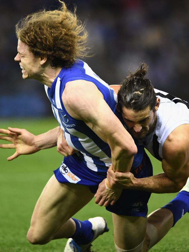 Brodie Grundy tackles Ben Brown.