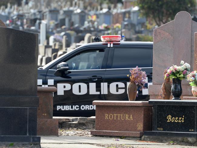 Police on the scene at the Preston cemetery. Picture: Andrew Henshaw