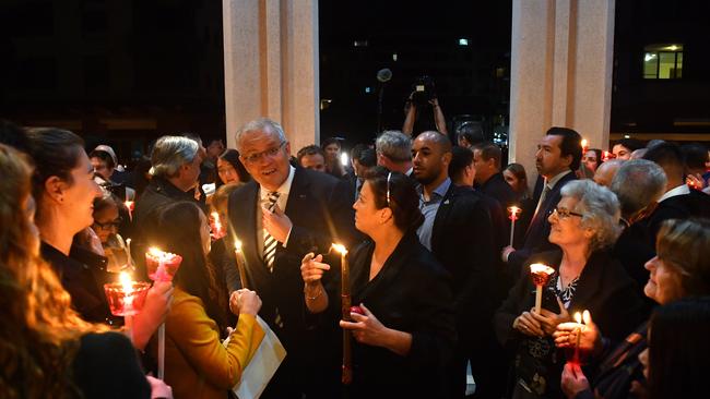 They also carried candles as part of the service. Picture: AAP