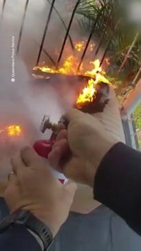 Rookie QLD cop scales balcony to put out fire