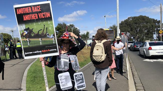 Racing protesters target punters outside Flemington Racecourse. Picture: Aneeka Simonis