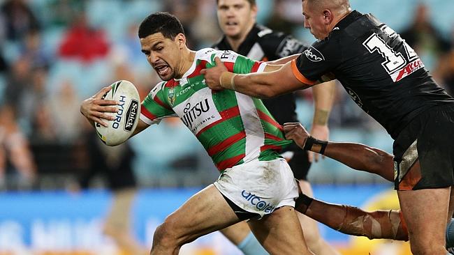 South Sydney's Cody Walker is tackled.