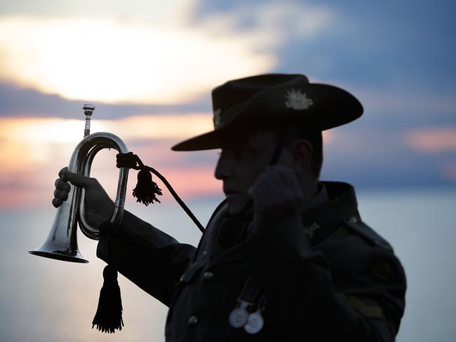 ECEABAT, TURKEY - APRIL 22: Corporal Andrew Barnett of the Australian Army Band, who will play the bugle at the upcoming Dawn Service commemoration ceremony to honour Australian and New Zealand soldiers killed in the Gallipoli Campaign, stands at Anzac Cove on April 22, 2015 near Eceabat, Turkey. Allied and Turkish representatives, as well as family members of those who served, will commemorate the 100th anniversary of the campaign with ceremonies scheduled for April 24-25. The Gallipoli land campaign, in which a combined Allied force of British, French, Australian, New Zealand and Indian troops sought to occupy the Gallipoli peninsula and the strategic Dardanelles strait during World War I, began on April 25, 1915 against Turkish forces of the Ottoman Empire. The Allies, unable to advance more than a few kilometers, withdrew after eight months. The campaign cost the Allies approximately 45,000 killed and up to 200,000 wounded, the Ottomans approximately 85,000 killed and 160,000 wounded. (Photo by Carsten Koall/Getty Images)