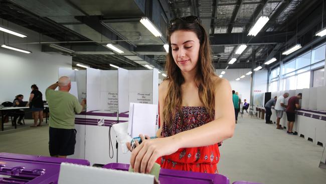 Darcie McManus of Freshwater casts her vote into the ballot box. BRENDAN RADKE