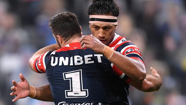 James Tedesco of the Roosters celebrates with Sitili Tupouniua (right) after scoring a try during the Round 5 NRL Match between the Canterbury Bulldogs and the Sydney Roosters at Bankwest Stadium in Sydney, Monday, June 15, 2020. (AAP Image/Dan Himbrechts) NO ARCHIVING, EDITORIAL USE ONLY