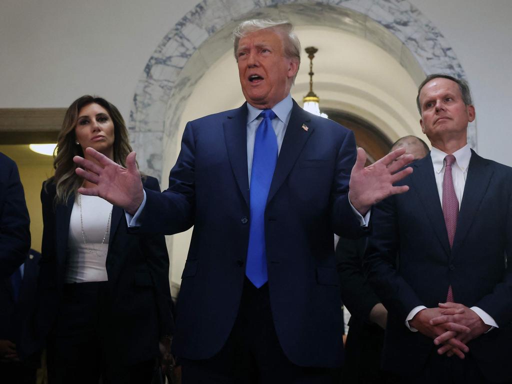 Former US President Donald Trump speaks to the media as he arrives at New York State Supreme Court to start the civil fraud trial against him on October 02, 2023. Picture: Getty.