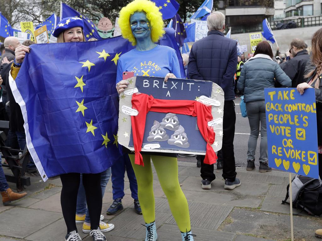 Demonstrators pose for photos while waiting for the start of a Peoples Vote anti-Brexit march in London, Saturday, March 23, 2019. Picture: AP Photo/Kirsty Wigglesworth