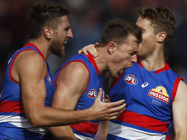 BALLARAT, AUSTRALIA - APRIL 10: Jack Macrae of the Bulldogs (C) celebrates a goal during the round four AFL match between the Western Bulldogs and the Brisbane Lions at Mars Stadium on April 10, 2021 in Ballarat, Australia. (Photo by Daniel Pockett/Getty Images)