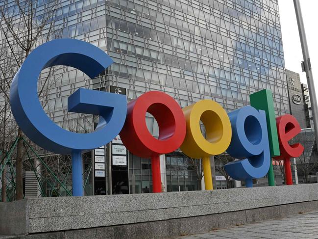 (FILES) The Google logo is seen outside a building housing Google offices in Beijing on February 4, 2025. A US judge on April 17, 2025 ruled that Google wielded monopoly power in the online ad technology market in a blow that could rattle the tech giant's revenue engine. The federal government and more than a dozen US states filed the antitrust suit against Alphabet-owned Google, accusing it of acting illegally to dominate three sectors of digital advertising -- publisher ad servers, advertiser tools, and ad exchanges. (Photo by GREG BAKER / AFP)