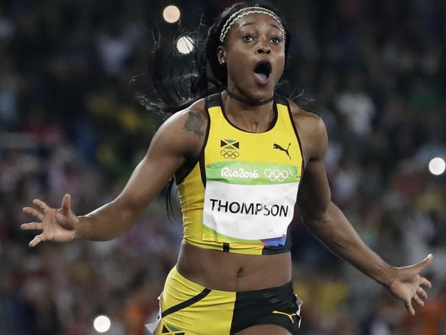 Jamaica's Elaine Thompson wins the gold medal in the women's 100-meter final during the athletics competitions of the 2016 Summer Olympics at the Olympic stadium in Rio de Janeiro, Brazil, Saturday, Aug. 13, 2016. (AP Photo/David J. Phillip)