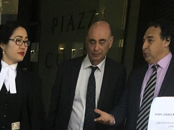 Fabio Zarfati (right) chats with his barrister Catherine Lin (left) upon leaving Downing Centre court complex