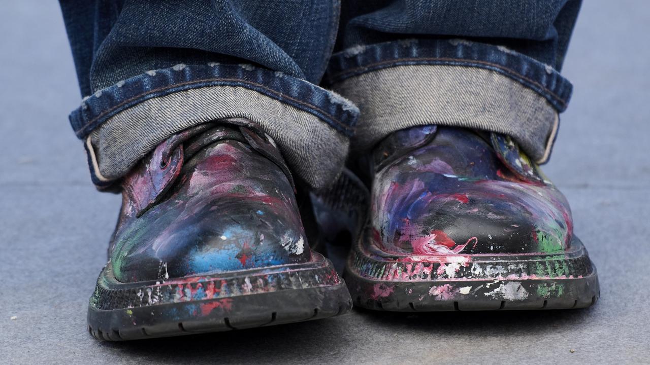 Paint covered Depp’s shoes at the event. Picture: Carlos Alvarez/Getty Images