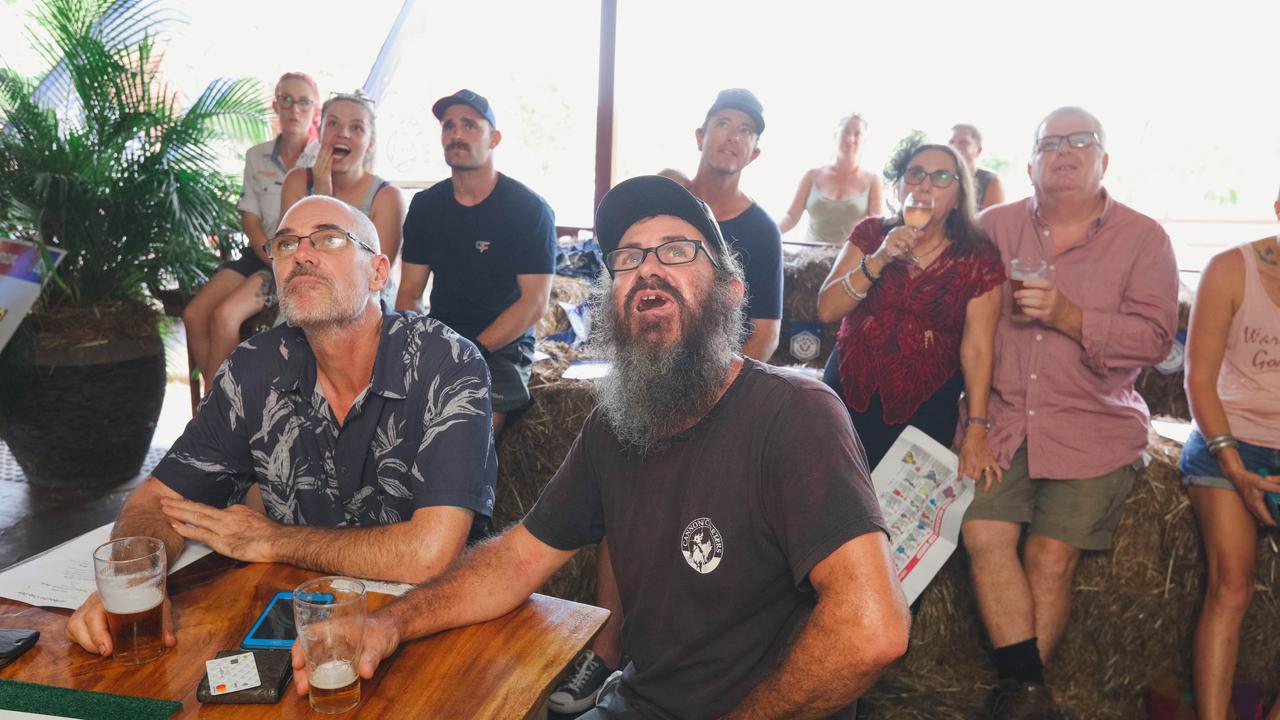 Croc racing at the Berry Springs Tavern for Melbourne Cup Day: Ben Sambrooks and Glen Gardner watch the Melbourne Cup result on TV. Picture: GLENN CAMPBELL