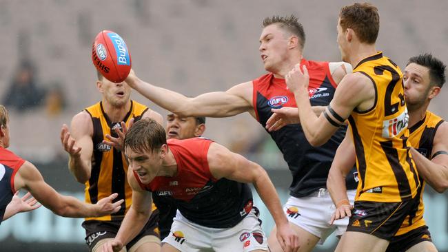 Tom McDonald tries to control the ball in congestion. Picture: AAP