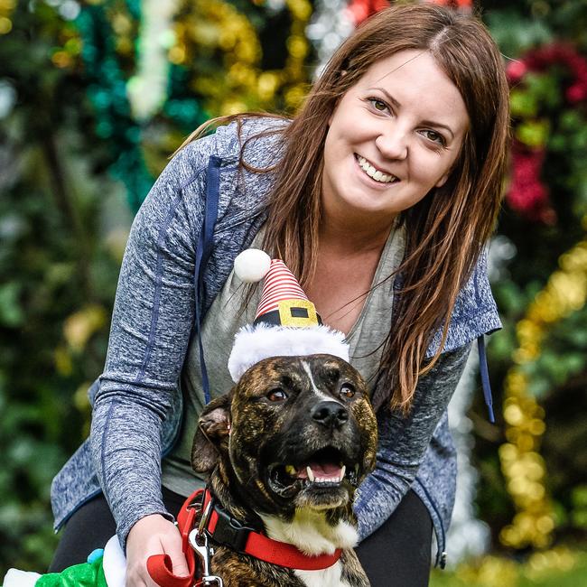 SA Dog Rescue volunteer Lisa Porcaro with Buddy the rescue dog. Picture: AAP/Roy VanDerVegt