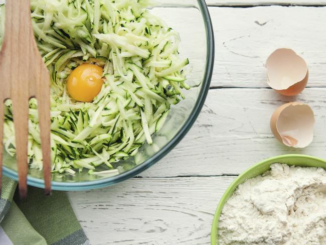 Table with ingredients for cooking zucchini fritters