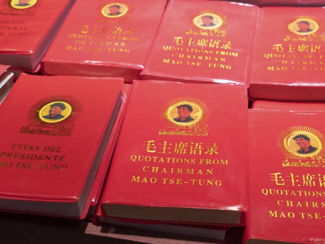 Rows of Chairman Mao's Little Red Book for sale at a market in China. The book contains statements from speeches and writings of the former Chairman of the Communist Party, and is widely available throughout the country.