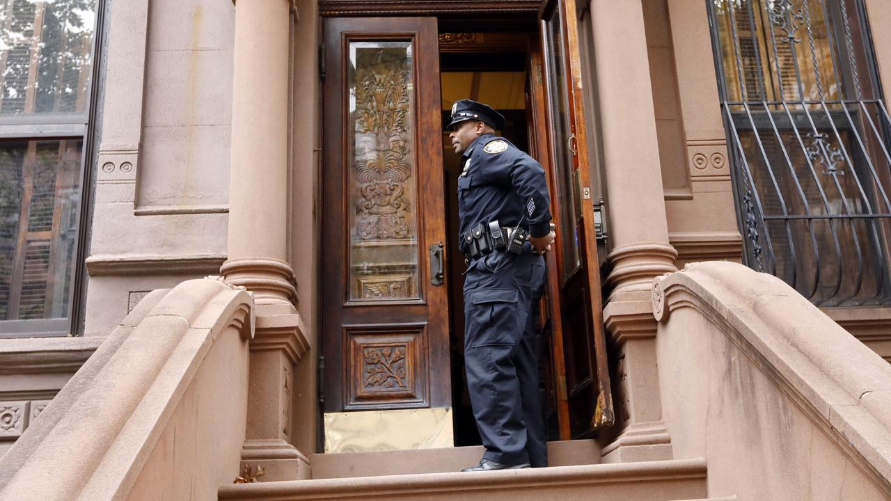 A New York City Police officer stands in the doorway of a residential building in New York's Harlem neighbourhood, Thursday, Nov. 7, 2019. Picture: AP/Richard Drew.