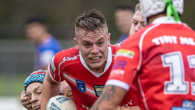 East Campbelltown’s Riley Williams is tackled by Tyrone Tsagalias. Pics by Julian Andrews.