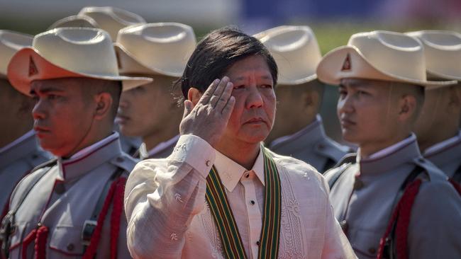 Ferdinand Marcos reviews an honour guard at Manila’s Fort Bonifacio on Wednesday. Picture: Getty Images