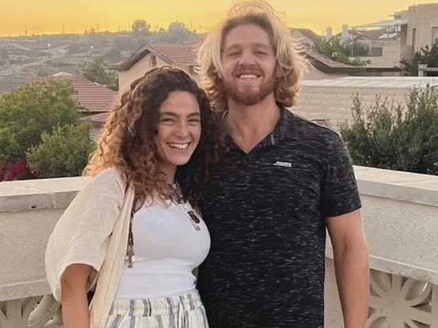 A 27-year-old Israeli model who survived the Hamas festival massacre has recounted how she was forced to hide under her boyfriend‘s dead body