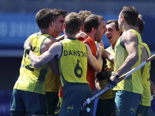 TOKYO, JAPAN - AUGUST 01: Andrew Lewis Charter and Matthew Dawson of Team Australia and teammates celebrate after winning the penalty shootout after the Men's Quarterfinal match between Australia and Netherlands on day nine of the Tokyo 2020 Olympic Games at Oi Hockey Stadium on August 01, 2021 in Tokyo, Japan. (Photo by Naomi Baker/Getty Images)