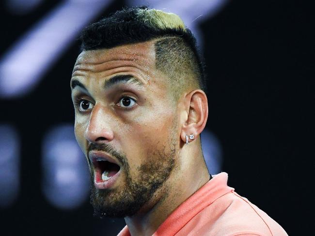 Australia's Nick Kyrgios reacts after a point against Spain's Rafael Nadal during their men's singles match on day eight of the Australian Open tennis tournament in Melbourne on January 27, 2020. (Photo by William WEST / AFP) / IMAGE RESTRICTED TO EDITORIAL USE - STRICTLY NO COMMERCIAL USE