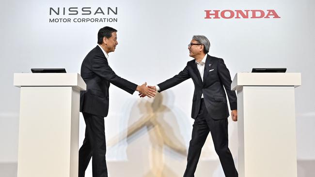 Makoto Uchida, president and CEO of Nissan, and Toshihiro Mibe, director, president and representative executive officer of automaker Honda. Photo: Richard A. Brooks / AFP