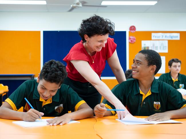 St Teresa's College, Abergowie, is Queensland's most improved high school for NAPLAN 2019. Students Jayden Harris and Bobby Nawie, with Assistant PrincipalTeaching and Learning Mrs Lee Shannon.