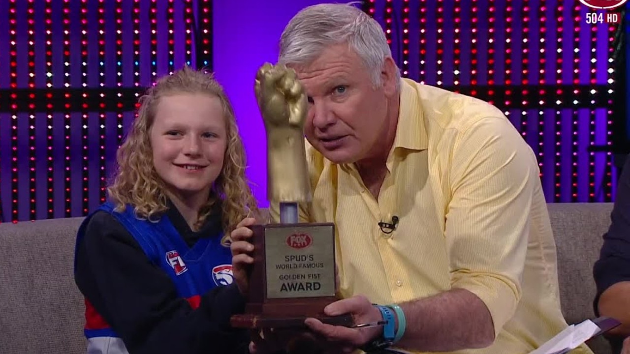 Danny Frawley and a fan giving out the Golden Fist Award for the week on Bounce.