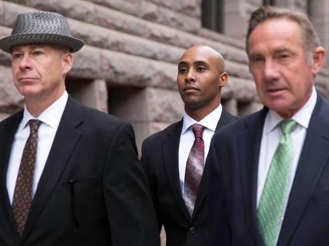 Mohamed Noor accompanied by his legal team, Peter Wold, right, and Tom Plunkett, left.  Picture:  Kerem Yucel