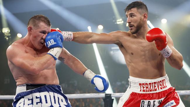 Kris Terzievski lays a punch on Paul Gallen.