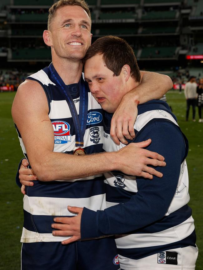 Selwood with Sam Moorfoot after he helped him over the fence. Picture: Getty Images