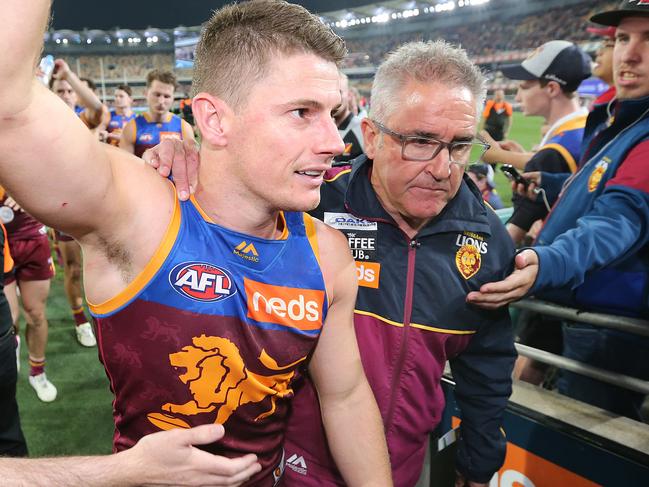 BRISBANE, AUSTRALIA - SEPTEMBER 14: Dayne Zorko of the Lions leaves the ground with coach Chris Fagan after the loss, during the AFL Semi Final match between the Brisbane Lions and the Greater Western Sydney Giants at The Gabba on September 14, 2019 in Brisbane, Australia. (Photo by Jono Searle/AFL Photos/via Getty Images)