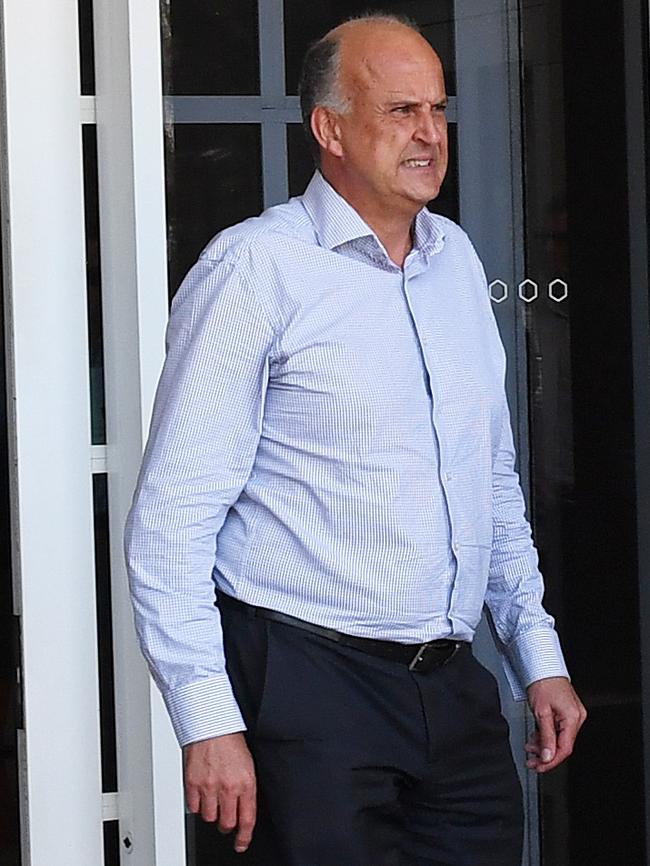 Elders Ltd Northern zone operations manager Tim Walker leaves the NT Supreme Court during the fraud trial of the firm's former head of Darwin real estate, Chris Deutrom